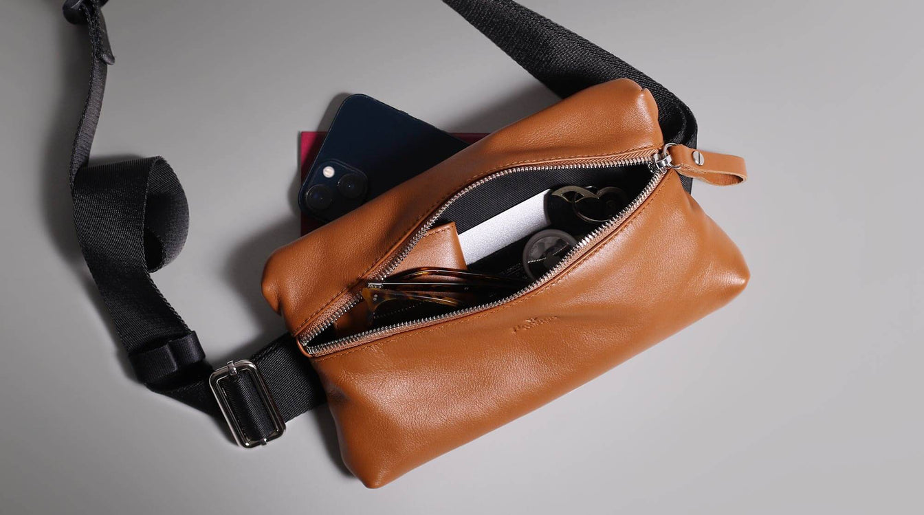 Slim leather sling bag for travel